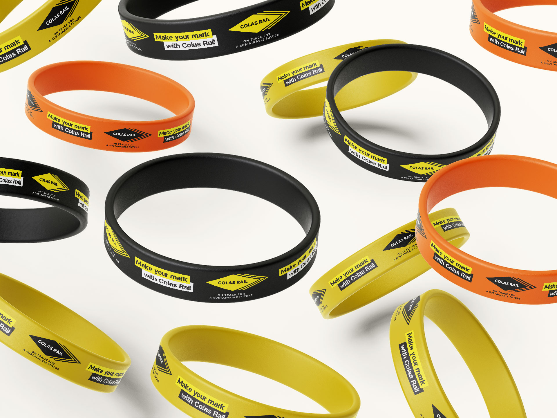 An image to show how the Colas Rail branding can look on different coloured wristbands.